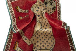 Corner detail of 2000s Persian Gabbeh rug showing border pattern and Wool pile