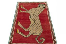 Surface texture of 2000s Persian Gabbeh rug with natural Wool and intricate pattern