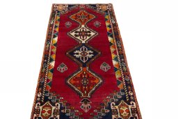 Surface texture of 2000s Persian Gabbeh rug with natural Wool and intricate pattern