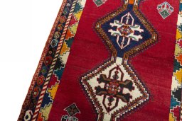 Backside of handmade 2000s Persian Gabbeh rug showing knot structure and weave density