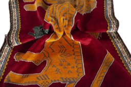 Corner detail of 2000s Persian Gabbeh rug showing border pattern and Wool pile