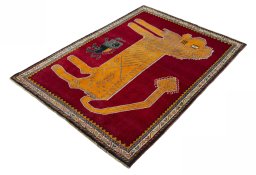 Corner detail of 2000s Persian Gabbeh rug showing border pattern and Wool pile