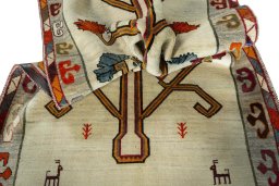 Corner detail of 2000s Persian Gabbeh rug showing border pattern and Wool pile