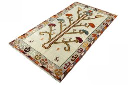 Corner detail of 2000s Persian Gabbeh rug showing border pattern and Wool pile