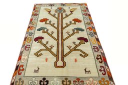 Surface texture of 2000s Persian Gabbeh rug with natural Wool and intricate pattern