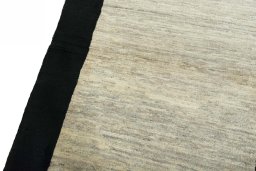 Backside of handmade New Persian Gabbeh rug showing knot structure and weave density