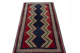Surface texture of 2000s Persian Gabbeh rug with natural Wool and intricate pattern