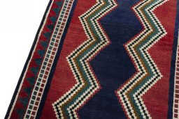 Backside of handmade 2000s Persian Gabbeh rug showing knot structure and weave density