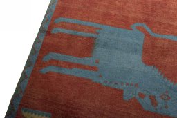 Backside of handmade 2000s Persian Gabbeh rug showing knot structure and weave density