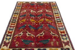 Surface texture of 2000s Persian Gabbeh rug with natural Wool and intricate pattern