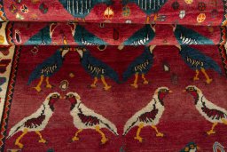 Full view of 2000s Persian Gabbeh rug from Iran / Persia, 246 × 161 cm in Red tones