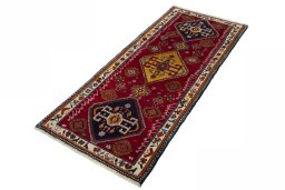 Corner detail of 2000s Persian Gabbeh rug showing border pattern and Wool pile