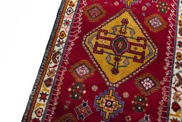 Backside of handmade 2000s Persian Gabbeh rug showing knot structure and weave density