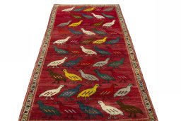 Surface texture of 2000s Persian Gabbeh rug with natural Wool and intricate pattern