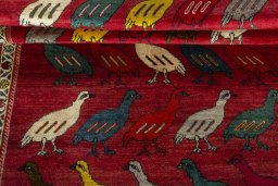 Full view of 2000s Persian Gabbeh rug from Iran / Persia, 296 × 127 cm in Red tones