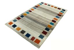 Corner detail of 2000s Persian Gabbeh rug showing border pattern and Wool pile