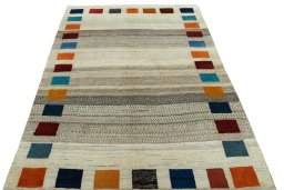 Surface texture of 2000s Persian Gabbeh rug with natural Wool and intricate pattern