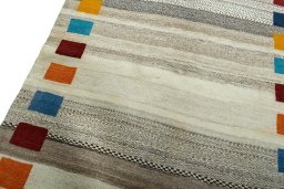 Backside of handmade 2000s Persian Gabbeh rug showing knot structure and weave density