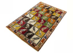 Corner detail of 1970s Persian Gabbeh rug showing border pattern and Wool pile