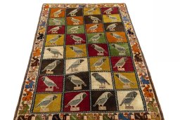 Surface texture of 1970s Persian Gabbeh rug with natural Wool and intricate pattern