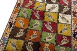 Backside of handmade 1970s Persian Gabbeh rug showing knot structure and weave density