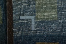 Surface texture of 2000s Persian Gabbeh rug with natural Wool and intricate pattern