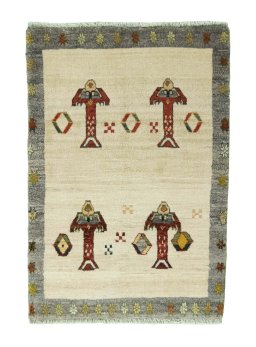 Full view of 2000s Persian Gabbeh rug from Iran / Persia, 117 × 81 cm in Beige tones