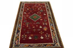Surface texture of 2000s Persian Gabbeh rug with natural Wool and intricate pattern