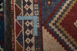 Close-up detail of 2000s Persian Gabbeh rug from Iran / Persia showing Wool weave