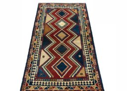 Surface texture of 2000s Persian Gabbeh rug with natural Wool and intricate pattern