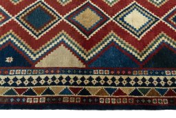Close-up detail of 2000s Persian Gabbeh rug from Iran / Persia showing Wool weave