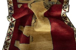 Corner detail of 2000s Persian Gabbeh rug showing border pattern and Wool pile