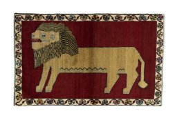 Full view of 2000s Persian Gabbeh rug from Iran / Persia, 167 × 105 cm in Red tones