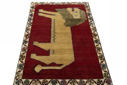 Surface texture of 2000s Persian Gabbeh rug with natural Wool and intricate pattern