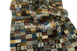 Corner detail of 2000s Persian Gabbeh rug showing border pattern and Wool pile