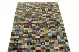 Surface texture of 2000s Persian Gabbeh rug with natural Wool and intricate pattern