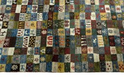 Close-up detail of 2000s Persian Gabbeh rug from Iran / Persia showing Wool weave