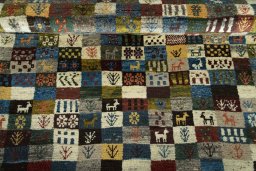 Full view of 2000s Persian Gabbeh rug from Iran / Persia, 176 × 125 cm in Multi Color tones