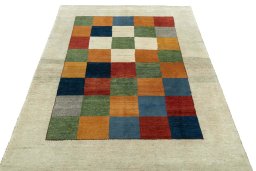 Surface texture of 2000s Persian Gabbeh rug with natural Wool and intricate pattern