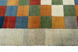 Backside of handmade 2000s Persian Gabbeh rug showing knot structure and weave density