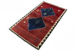 Corner detail of 2000s Persian Gabbeh rug showing border pattern and Wool pile