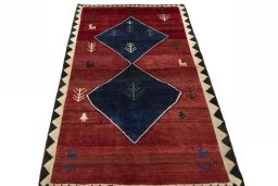 Surface texture of 2000s Persian Gabbeh rug with natural Wool and intricate pattern