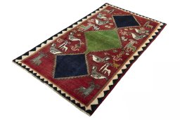 Corner detail of 2000s Persian Gabbeh rug showing border pattern and Wool pile