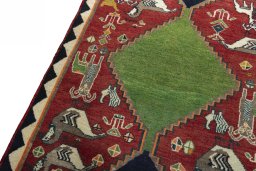 Backside of handmade 2000s Persian Gabbeh rug showing knot structure and weave density
