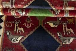 Full view of 2000s Persian Gabbeh rug from Iran / Persia, 205 × 120 cm in Red tones