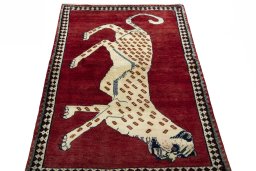 Surface texture of 2000s Persian Gabbeh rug with natural Wool and intricate pattern