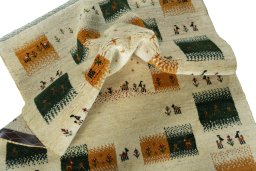 Corner detail of 2000s Persian Gabbeh rug showing border pattern and Wool pile
