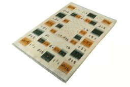 Corner detail of 2000s Persian Gabbeh rug showing border pattern and Wool pile