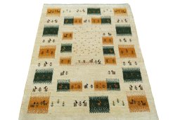 Surface texture of 2000s Persian Gabbeh rug with natural Wool and intricate pattern