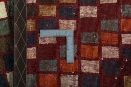 Close-up detail of 2000s Persian Gabbeh rug from Iran / Persia showing Wool weave